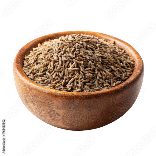 A rustic wooden bowl overflowing with fragrant whole cumin seeds 