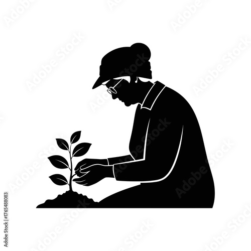 Nurturing Silhouette of a Woman Tending to a Young Growing Plant in a Pot