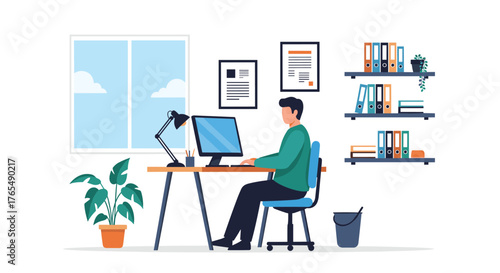Man working on computer at home office desk.