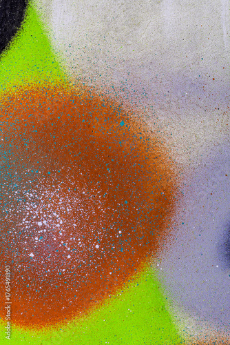 colorful background pattern of urban streen wall graffiti for concept and design. Aerosol bright vivid painting on a city walls