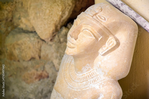 Statue of goddess carved from stone. Beautiful souvenir from Egypt. Close-up.