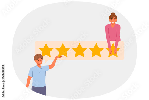 Rating given by business people who rate quality of service as 5 stars to praise seller. Happy Man and woman provide feedback and influence rating, wanting to share own user experience.