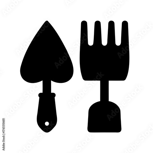 Black silhouette of garden trowel and hand fork isolated on white backdrop