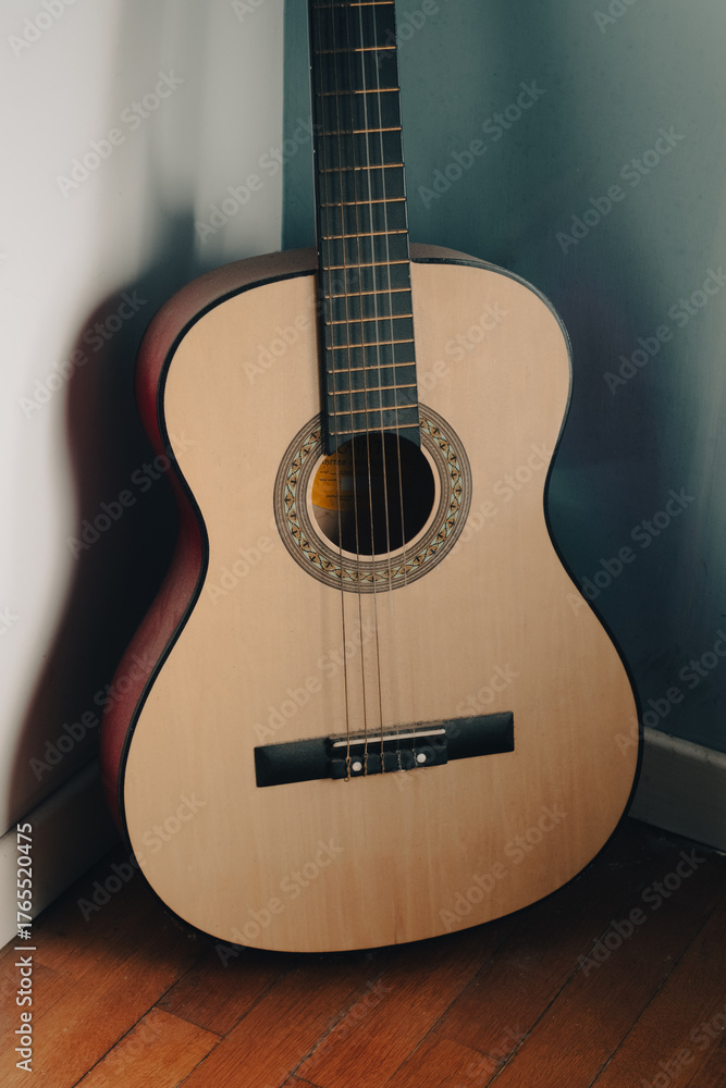 Obraz premium Guitar. Guitar chords. Acoustic guitar. Music. Background music. Image of an acoustic guitar. Bright light. Shadows.