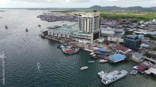 Aerial footage view of commercial pier and fisherman village at Semporna, a city on east coast of Sabah in Malaysia, Tawau District, Borneo island
