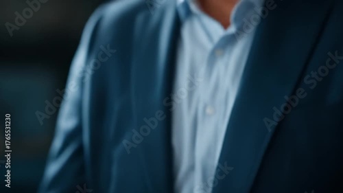 Hand holding smartphone with glowing white profile icons on a blurry blue background