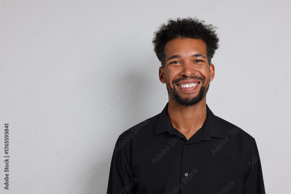 Fototapeta premium Portrait of handsome man on white background, space for text
