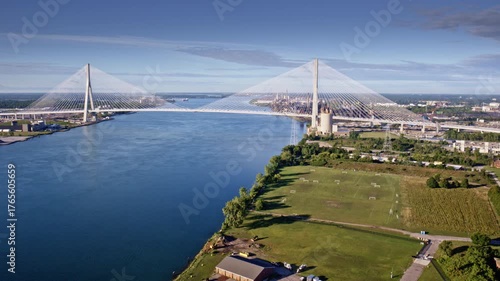 Drone glides over Gordie Howe International Bridge en route to the industrial area along the Detroit River.