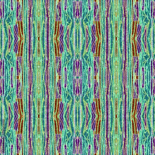 Vibrant, textured seamless pattern with a strong vertical Ikat tribal aesthetic. Features abstract geometric motifs in teal, purple, maroon, and lime green with a rough, painterly feel.