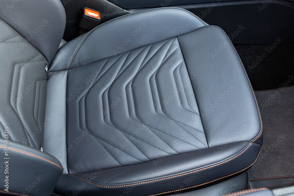 Obraz premium New, modern car black, quilted leather front passenger seat.Top down view, no people