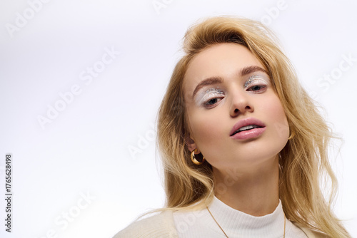 Wallpaper Mural Winter beauty and cozy style showcased by a young blonde woman with sparkling makeup Torontodigital.ca