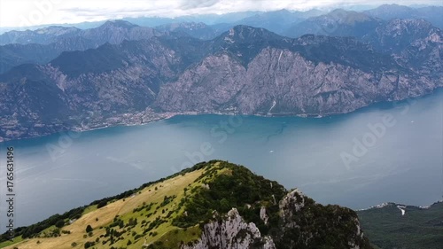 Italian lake with surrounding mountains aerial