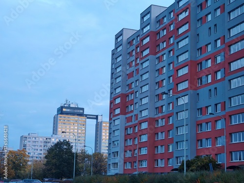 Photography Massive concrete panel buildings (panelak)from the communist era, typical of suburban housing estates on the outskirts of Prague, showcasing brutalist urban design
