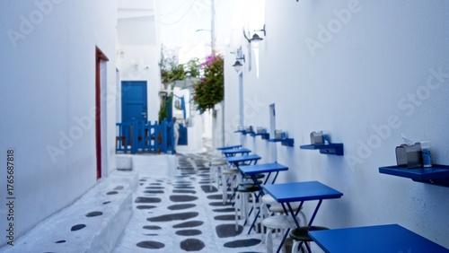 Photos Soft defocused whitewashed alley with blue cafe tables, stone path and sunlit walls, alley; background backdrop copyspace calm