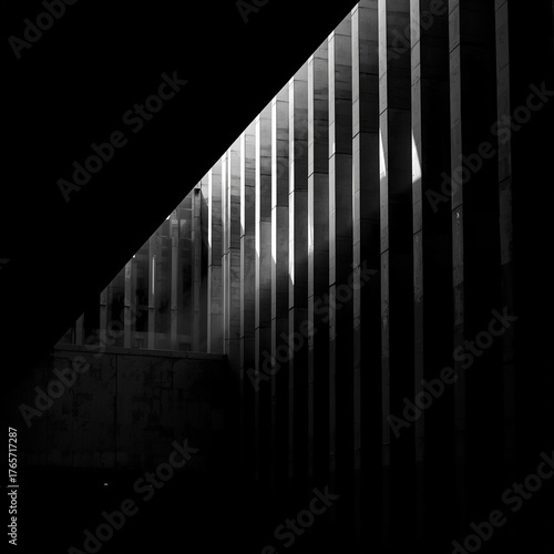 Wallpaper Mural High-contrast monochrome photo of city architecture with dramatic light and shadow interplay. Clean lines, geometric balance, and sharp perspective create abstract modern feel suitable Torontodigital.ca