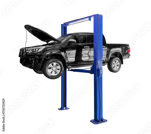 Black pickup truck on blue car lift, It is lifted up to await maintenance at a garage or service center isolated on white background