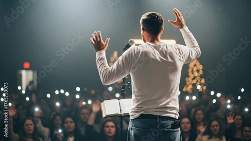 Man preacher speaking at protestant church service in front of people raising illuminated hands, modern christianity worship footage.