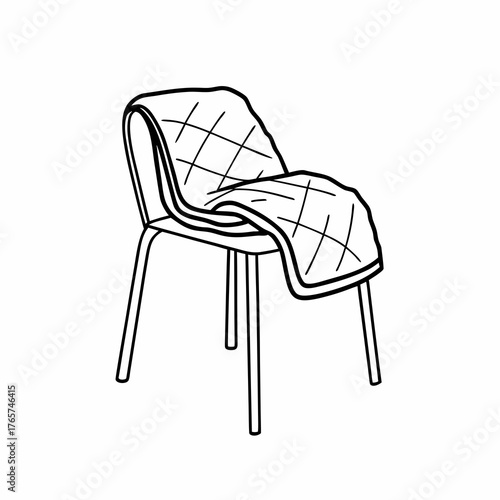 Cozy blanket draped over modern chair in minimalist style  