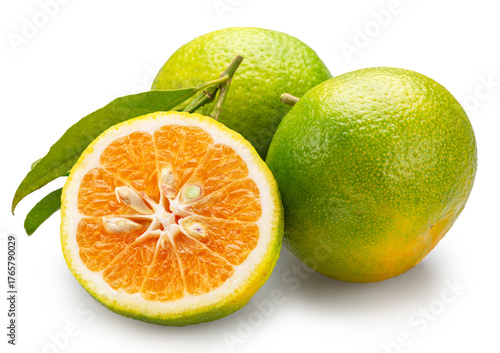Green tangerine and cross section of tangerine fruit isolated on white background. File contains clipping paths.
