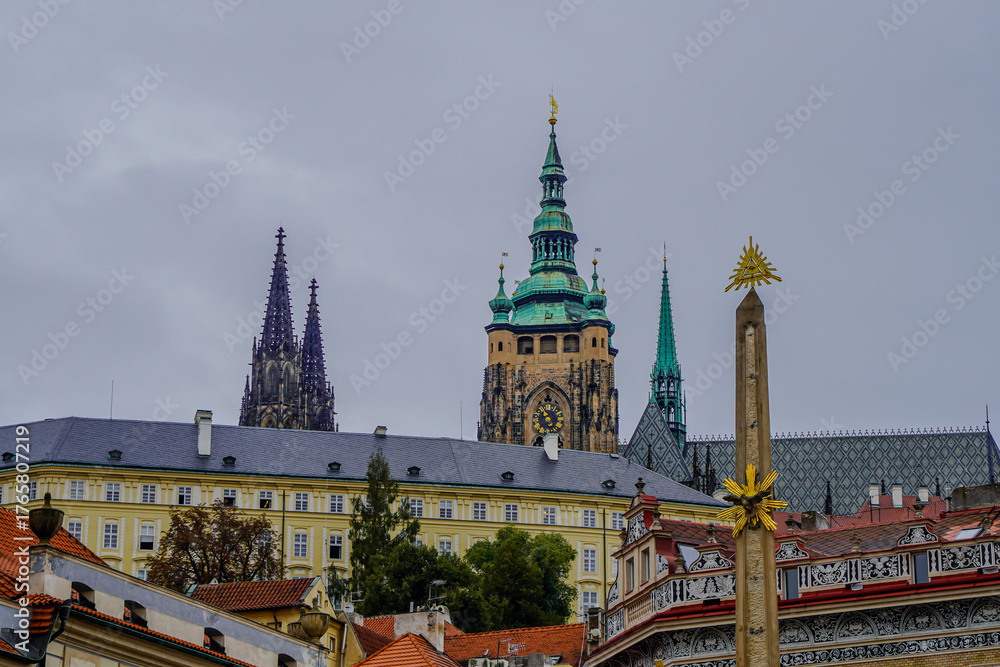 Fototapeta premium Beautiful aerial and detailed view of Prague Castle with St. Vitus Cathedral and the Old Royal Palace, Czech Republic — Gothic architecture and panoramic city skyline