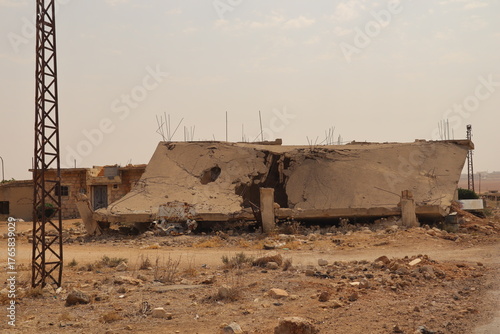 Obraz w ramie War damaged building in Aleppo, Syria, showing destruction from heavy battles. Powerful footage symbolizing war aftermath, humanitarian crisis, and urban reconstruction potential.