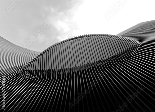 Cuadro en lienzo Modern Building Facade Curve Wall Steel Pattern Metalwork Texture low Angle view