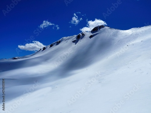 The snow-covered Aquila and Aquilotto mountains above Lake Santo in the Parma Apennines