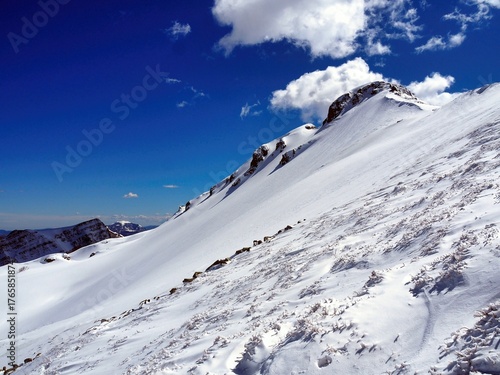 The snow-covered Aquila and Aquilotto mountains above Lake Santo in the Parma Apennines