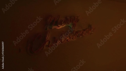 Merry Christmas with red neon lights with animation changing color to green and turning off