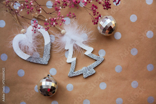 Christmas festive background with basic classic pattern, copy space. Trendy decorations with disco balls and pink gypsophila. Christmas atmosphere. Merry Christmas and home coziness concept