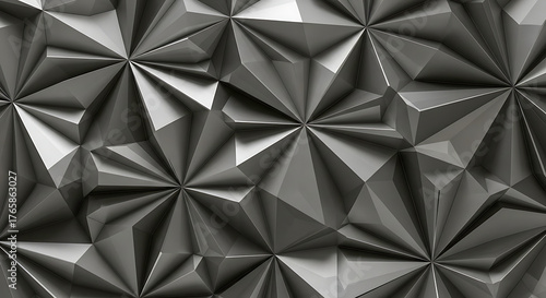 Abstract geometric metallic surface with sharp facets and dramatic light and shadow play