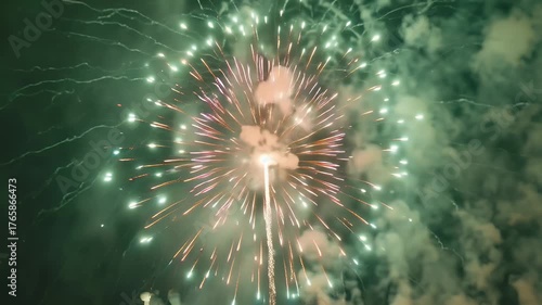 A Brilliant Nighttime Fireworks Display Exploding in Multicolored Lights Over Smoke