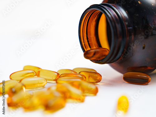 Dietary Supplements: Capsules Scattered from Container