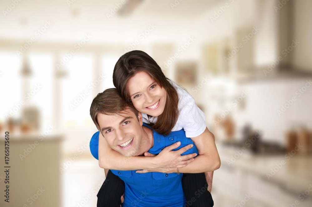 Fototapeta premium Happy beautiful couple cuddling enjoy talk at home