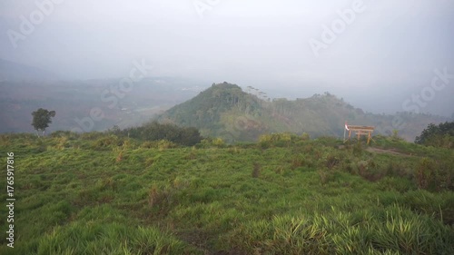 Beautiful morning view on Mount Pangradinan, with clear weather among the hills and green trees.