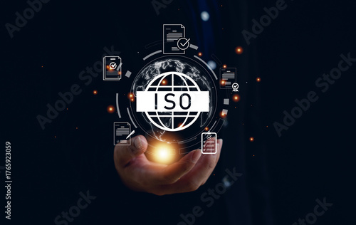 ISO certification and quality management concept. Businessman holding glowing ISO icon with document and checklist graphics, symbolizing standards, compliance, and global quality assurance.