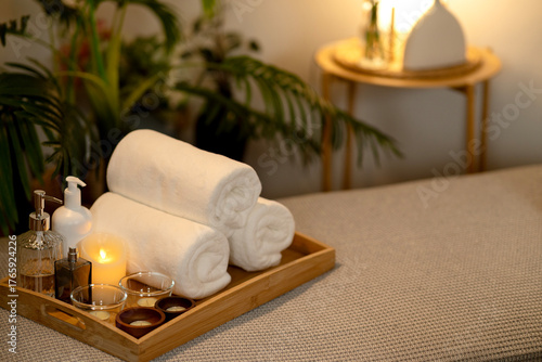 Spa wellness items essential relaxation warm candlelight soft towels oils serene home environment luxurious resort