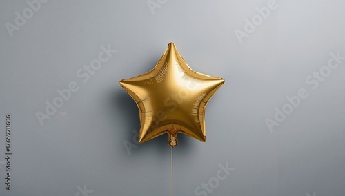 Golden Star Balloon on a Muted Grey Backdrop, Simple Celebration Motif.