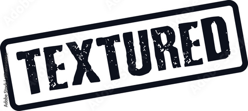 Distressed black rubber stamp impression displaying the prominent word TEXTURED for describing surface properties