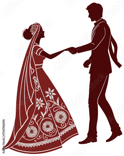 Silhouette of an indian couple holding hands in wedding attire