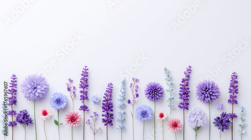 Pastel purple flower lavender border layout on white clean surface with delicate pink accents creating soft calming floral composition