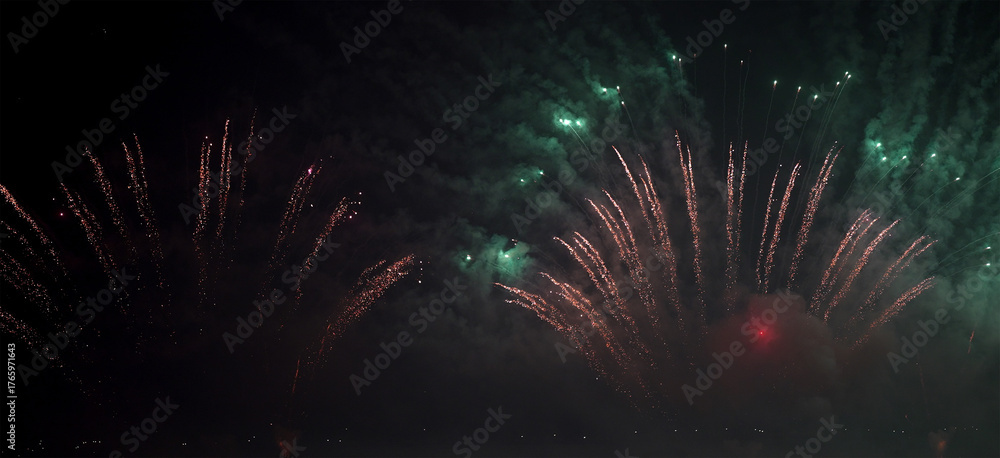 custom made wallpaper toronto digitaldynamic fireworks burst mixing green and red spark trails in the dark sky.