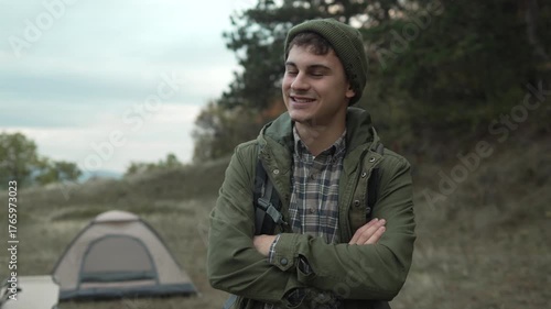 Young happy hiker man smiling outdoors