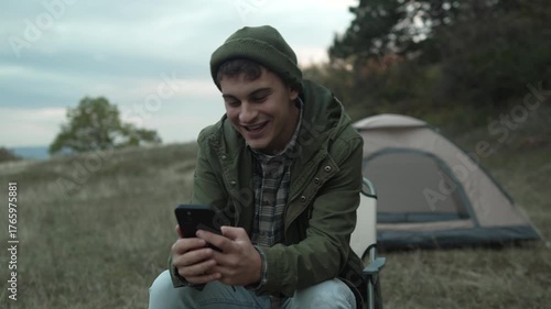 Young man having video call outdoors