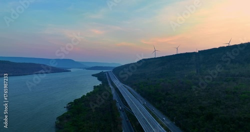  Drone captures Lam Takhong Dam and highway lights glowing warmly at dusk, where nature, technology, and travel connect in harmony across serene landscapes and reflective waters.