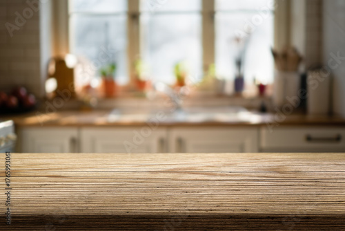 Natural wooden countertop and blurred background of a kitchen on morning hours