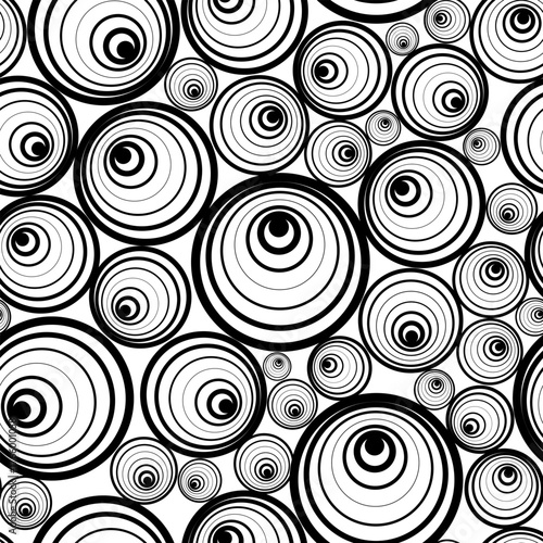 A seamless pattern of black and white circular shapes composed of eccentric circles of varying sizes. Vector illustration for prints on fabrics, wallpaper, and packaging in an abstract geometric style