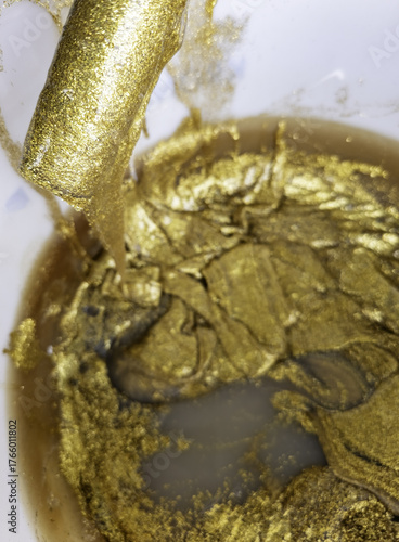 Can of gold paint