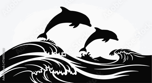 Two playful dolphins leap joyfully over cresting ocean waves under a bright sun.