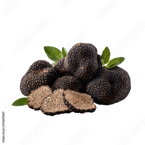 Gourmet black truffles artfully arranged with fresh green leaves and delicate slices